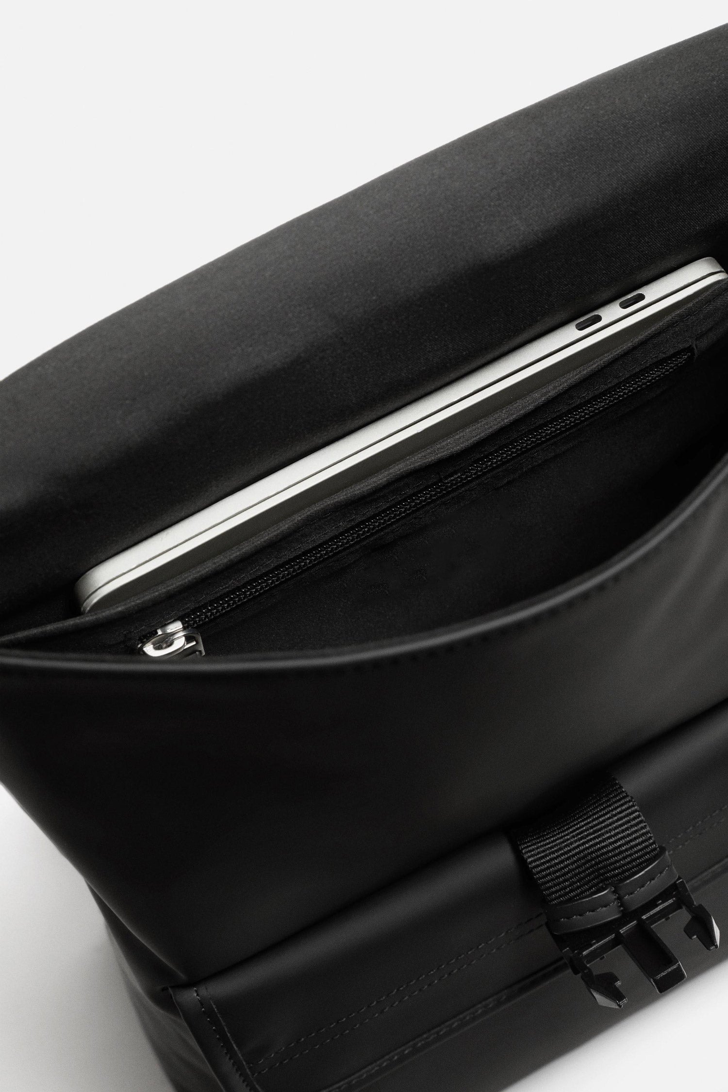 Person wearing Splash30 Urban Rubberized Backpack black lifestyle back view